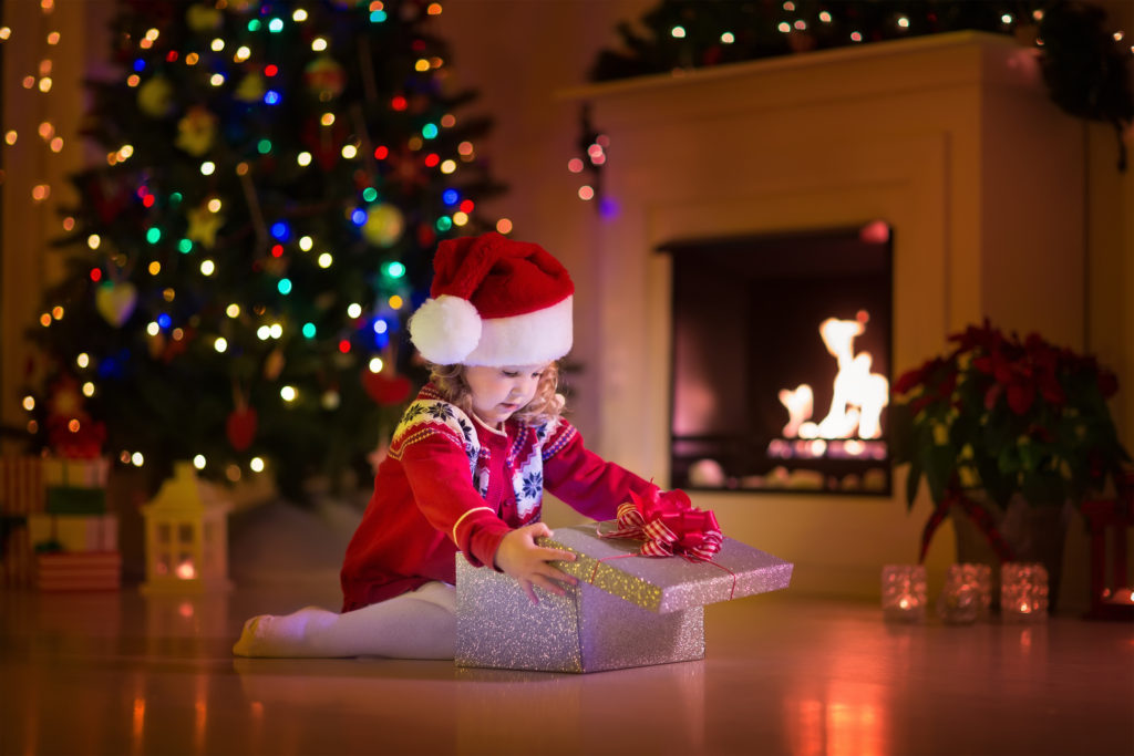 Kids Opening Christmas Presents At Fireplace  Upstream Petroleum
